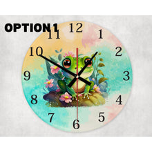 Load image into Gallery viewer, round glass wall clock featuring ahappy frog surrounded byblooming flowers.