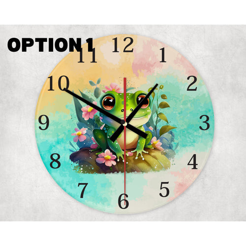 round glass wall clock featuring ahappy frog surrounded byblooming flowers.